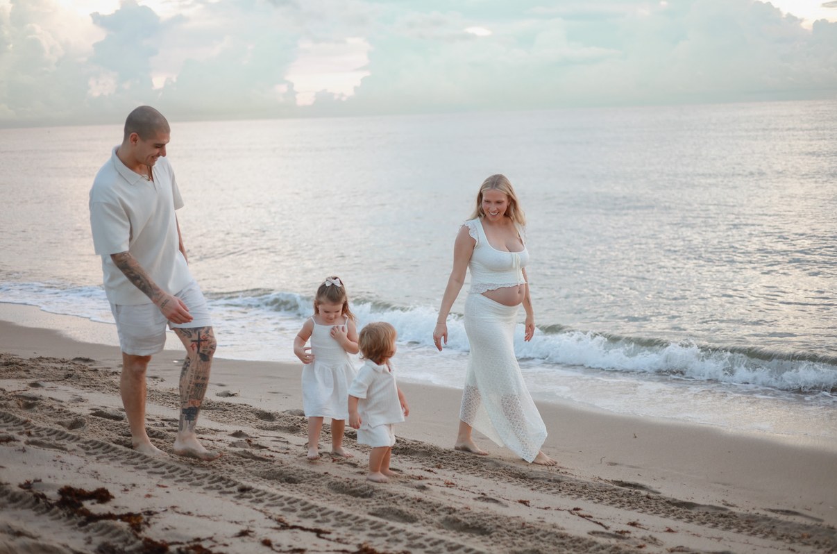 Nico Blachman with his wife and two kids on the beach